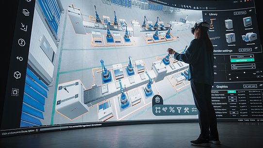 Frau steht mit VR-Brille vor Visualisierung